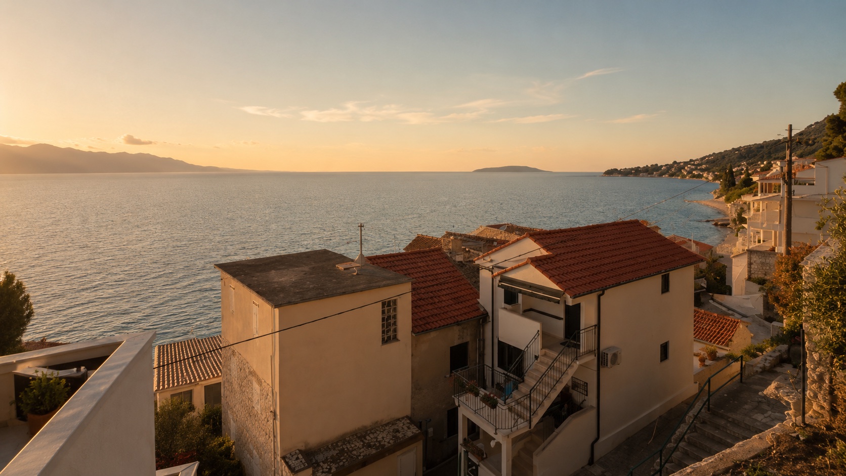 Golden-hour view over the rooftops of Brist to the Adriatic from Beach House Buinac, Makarska Riviera, Croatia