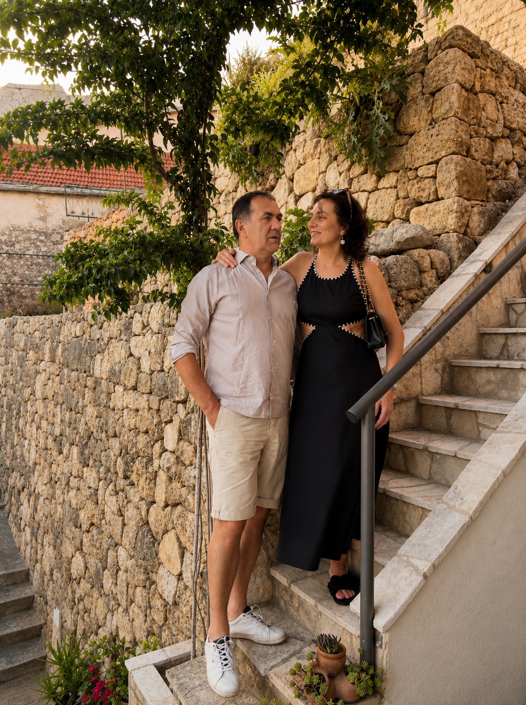 Mirko and Anita on the stone steps beside Beach House Buinac in Brist, Croatia